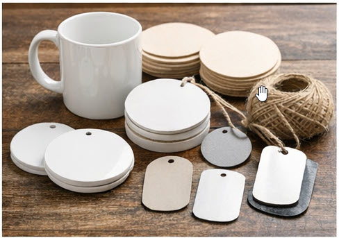 Ceramic mugs and metal tags used as craft blanks